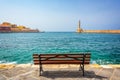 Empty bench with view on the venitian habor of Chania in Crete Grece Royalty Free Stock Photo