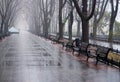 Empty benches along the empty valley in rain