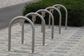 Empty bicycle parking metal rack near the road. Royalty Free Stock Photo