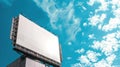 Empty billboard against a bright blue sky with clouds. Advertising space concept Royalty Free Stock Photo