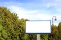 Empty billboard against green landscape Royalty Free Stock Photo