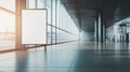 Empty billboard inside a modern airport terminal with large windows overlooking the runway. The spacious interior is Royalty Free Stock Photo
