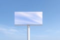 Blank billboard mock up against a clear blue sky, showcasing an empty advertising space for design purposes, with soft Royalty Free Stock Photo