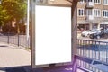 Empty billboard placeholder template on the city bus stop, mockup of a blank white advertising. Royalty Free Stock Photo