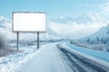 An empty billboard on a snowy road in winter