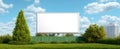 The empty billboard surrounded by lush greenery and a vibrant sky. AI generated image Royalty Free Stock Photo