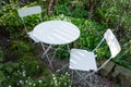 Empty bistro coffee table with chairs in garden