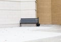 Empty Black Bench Outside Building for Smokers Royalty Free Stock Photo