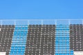 Empty black and blue seats in a row at the sport stadium Royalty Free Stock Photo