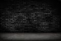 Empty black brick wall and concrete floor for background. Dark room interior with black brick wall blank cement floor for backdrop