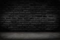 Empty black brick wall and concrete floor for background. Dark room interior with black brick wall blank cement floor for backdrop