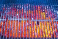 Empty black cast iron grill with hot red glowing Royalty Free Stock Photo