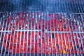 Empty black cast iron grill with hot red glowing Royalty Free Stock Photo