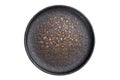 Empty black ceramic plate top view on white background. Minimal tableware mockup with copy space Royalty Free Stock Photo