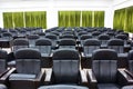 Empty black chairs in a conference