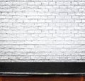 Empty black marble table and white brick wall in background. pro Royalty Free Stock Photo