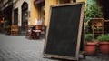 Empty black menu board mockup near restaurant or cafe entrance. Cafe menu on the street, advertising black mockup. Royalty Free Stock Photo