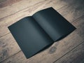 Empty black notepad on wooden desktop