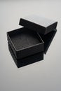 Empty black open jewelry box on glass background close up Royalty Free Stock Photo