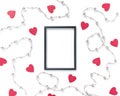 Empty black photo frame, red heart-shaped shapes and beads are on a white background. Valentine`s Day layout. Flat lay. Top view. Royalty Free Stock Photo