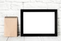 Empty black photo frame on wooden shelf or table. Mockup with copy space Royalty Free Stock Photo