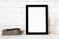 Empty black photo frame on wooden shelf or table. Mockup with copy space. Royalty Free Stock Photo