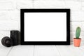 Empty black photo frame on wooden shelf or table. Mockup with copy space Royalty Free Stock Photo