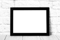 Empty black photo frame on wooden shelf or table. Mockup with copy space Royalty Free Stock Photo