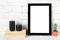 Empty black photo frame on wooden shelf or table. Mockup with copy space. Royalty Free Stock Photo