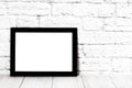 Empty black photo frame on wooden shelf or table. Mockup with copy space Royalty Free Stock Photo