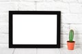 Empty black photo frame on wooden shelf or table. Mockup with copy space Royalty Free Stock Photo