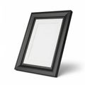 Empty Black Picture Frame with White Matting Tilted on White Background Royalty Free Stock Photo