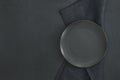 Empty black plate on dark stone background Royalty Free Stock Photo