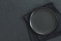 Empty black plate on dark stone background Royalty Free Stock Photo