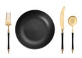 Empty black plate with golden fork, knife and spoon on white background, top view Royalty Free Stock Photo
