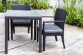 Black rattan chair and table set on balcony at home garden Royalty Free Stock Photo