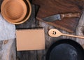 empty black round frying pan, cutting board  and spoon Royalty Free Stock Photo