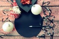 Empty black round  greeting card mockup with pen, christmas balls and black gift box on blue vintage wooden table , Typically used Royalty Free Stock Photo