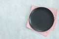 Empty black plate on dark stone background Royalty Free Stock Photo