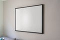 Empty black square frame, poster, white canvas mock up on a gray wall, living room template angle view Royalty Free Stock Photo