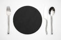 Empty black stone plate spoon fork knife Royalty Free Stock Photo