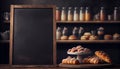 Empty blackboard on blurred bakery background, for text or graphics for food-related presentations, menus, or marketing