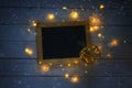 empty blackboard and decorative gold apple with lights