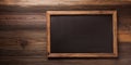 Empty blackboard with rustic wooden frame on wood background Royalty Free Stock Photo