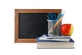 Empty blackboard, school accessories, stack of books and red apple isolated on white background Royalty Free Stock Photo