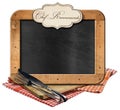 Empty Blackboard and Silver Cutlery above a Wooden Cutting Board Royalty Free Stock Photo