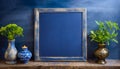 Empty blackboard with vase and flowers in a glass on dark blue background