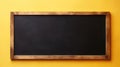 Empty blackboard with wooden frame on wooden table over yellow background created with Generative AI Royalty Free Stock Photo