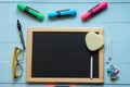Empty blank chalkboard with school goods