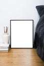 Empty blank classic black frame on a floor, minimal home bedroom Royalty Free Stock Photo